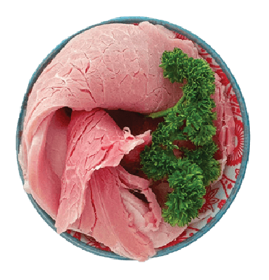 Thinly sliced pieces of Sloane's ham are arranged in a small, patterned bowl with a sprig of parsley.